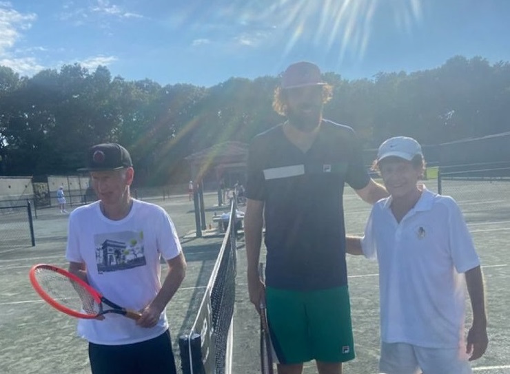 Dr. Marshall Hubsher alongside towering Reilly Opelka and legendary John McEnroe at Pro-Am event